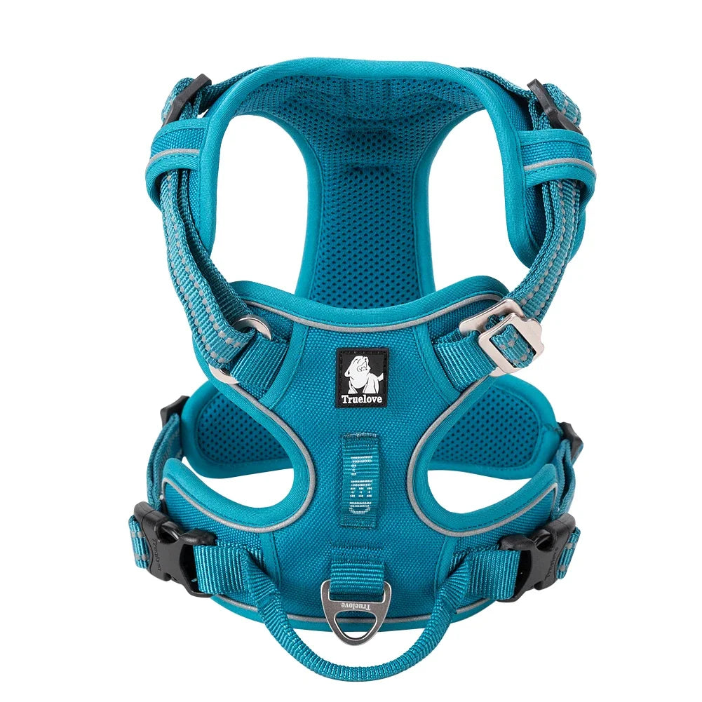 Blue dog harness with visible brand logo on a white background