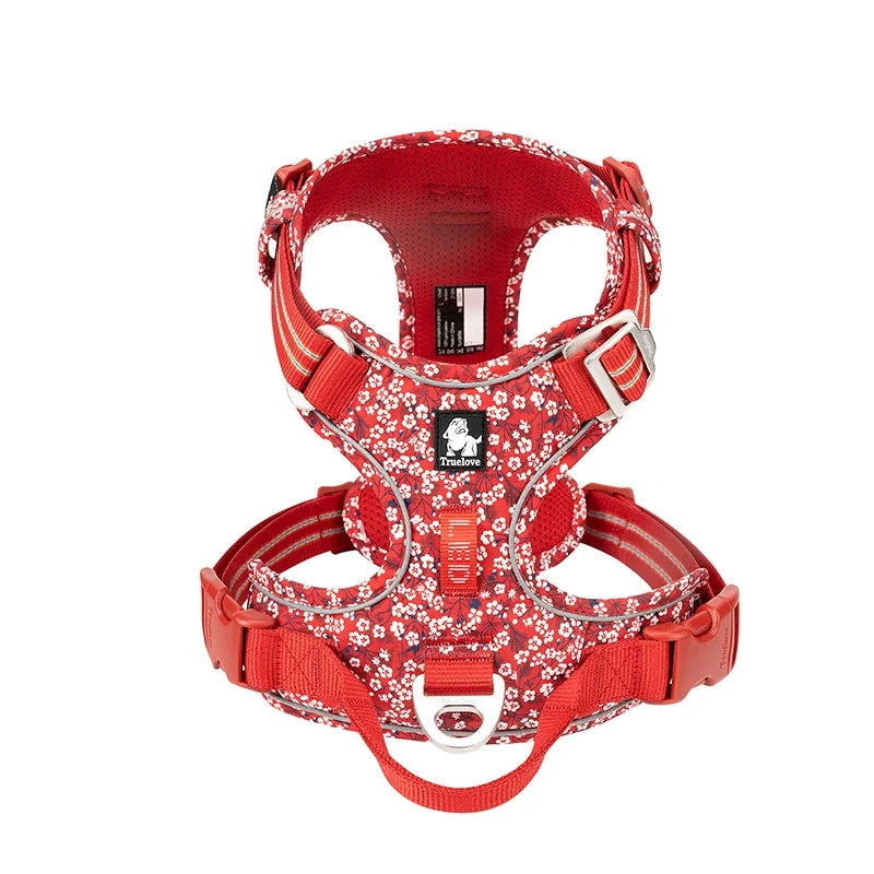 Red floral-patterned dog harness on a white background